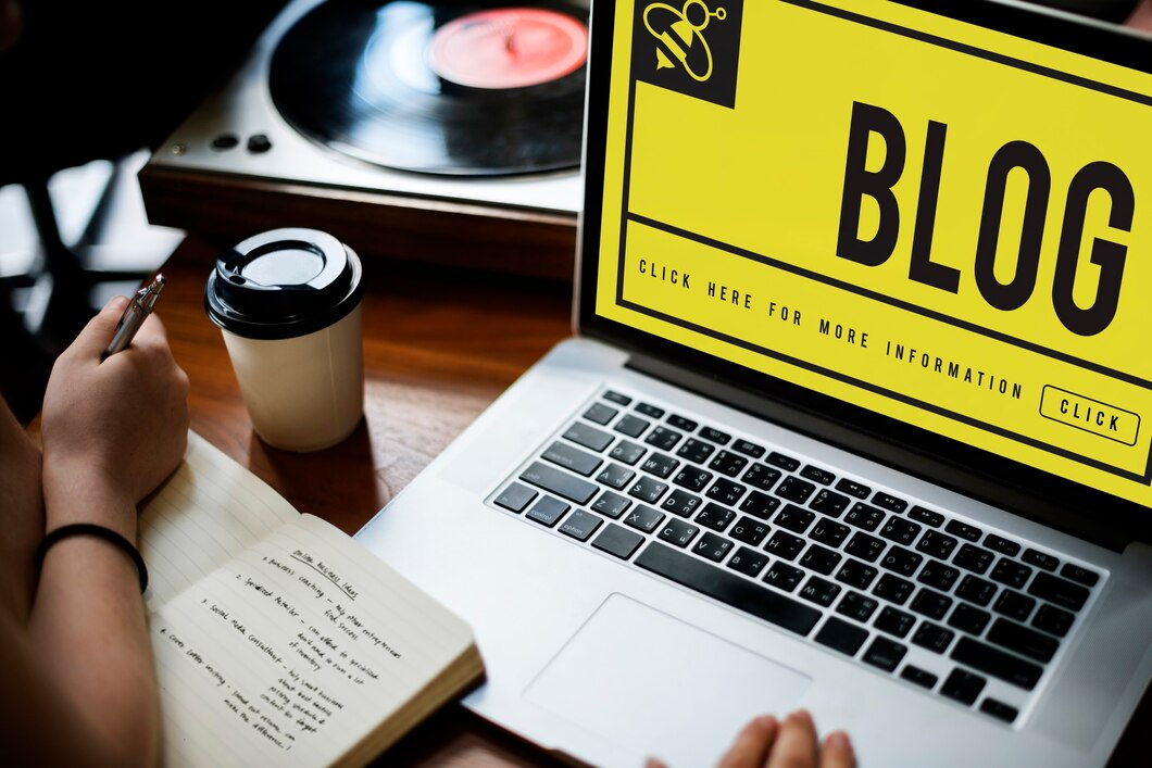 A laptop displaying the word 'BLOG'