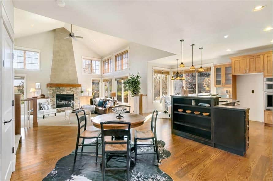 The breakfast area offers a round dining set sitting on a cowhide rug.
