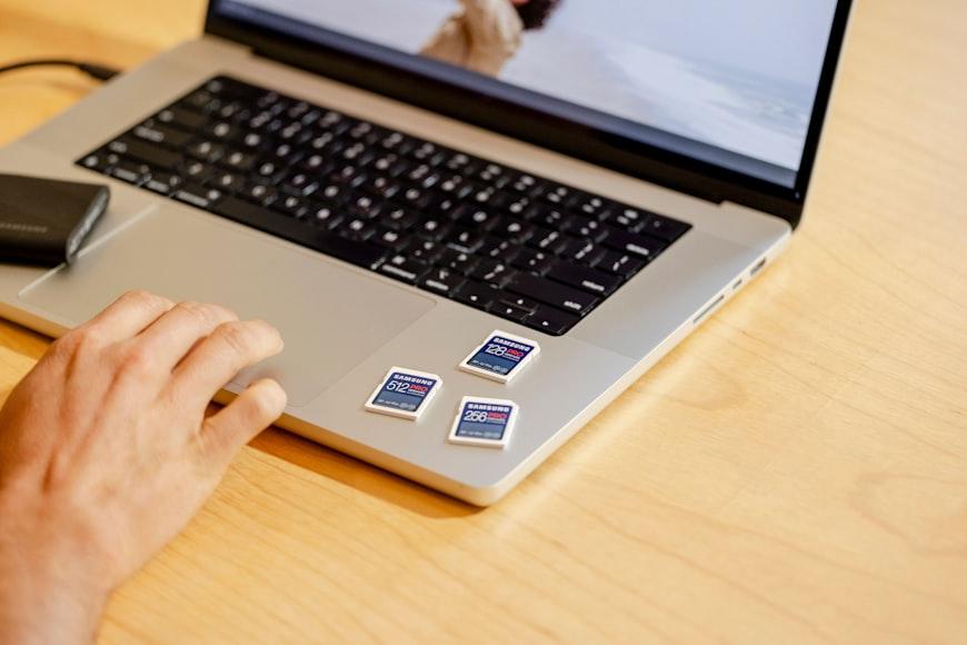 A person using a laptop computer on a desk