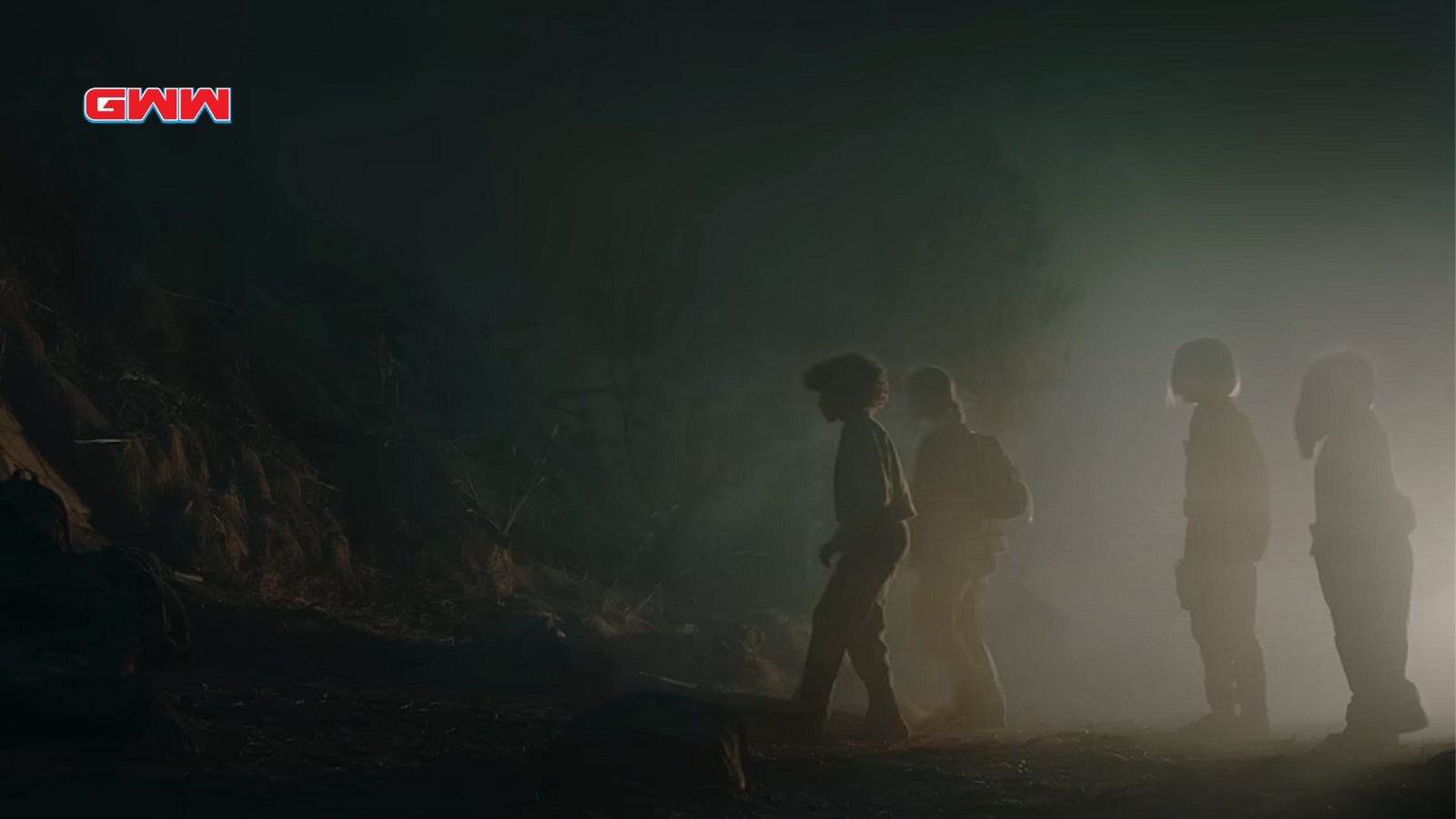 Four kids walking in a foggy, eerie landscape at night in Skeleton Crew (2024)