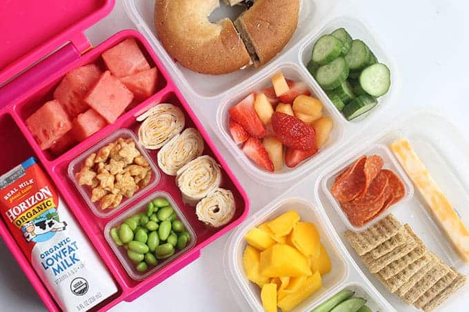 A lunch box filled with a healthy meal that follows a balanced diet chart for 10 year old child.
