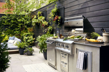 ways to create your dream outdoor kitchen green decor next to grill and seating area custom built michigan