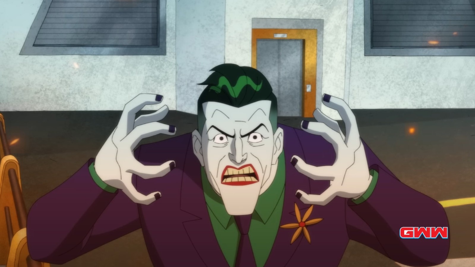 Joker (Alan Tudyk) angrily gesturing with manic intensity in a warehouse setting