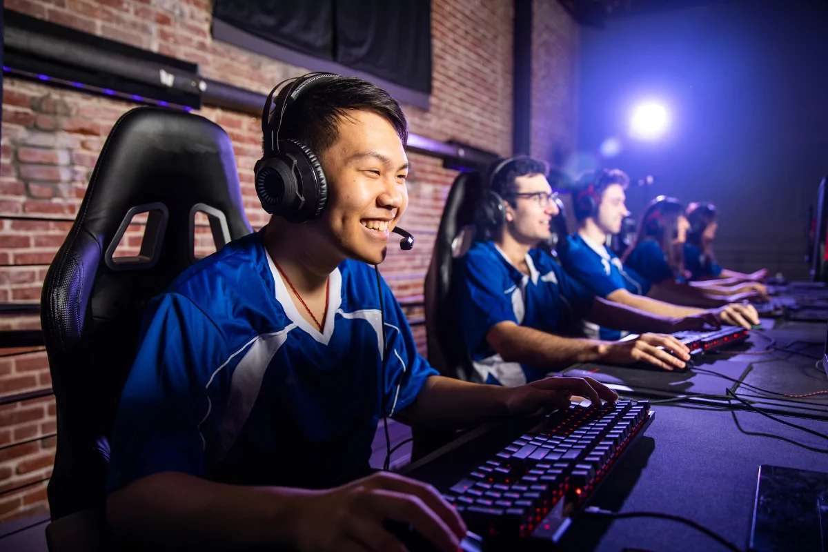 Image of an Asian team engaged in video games