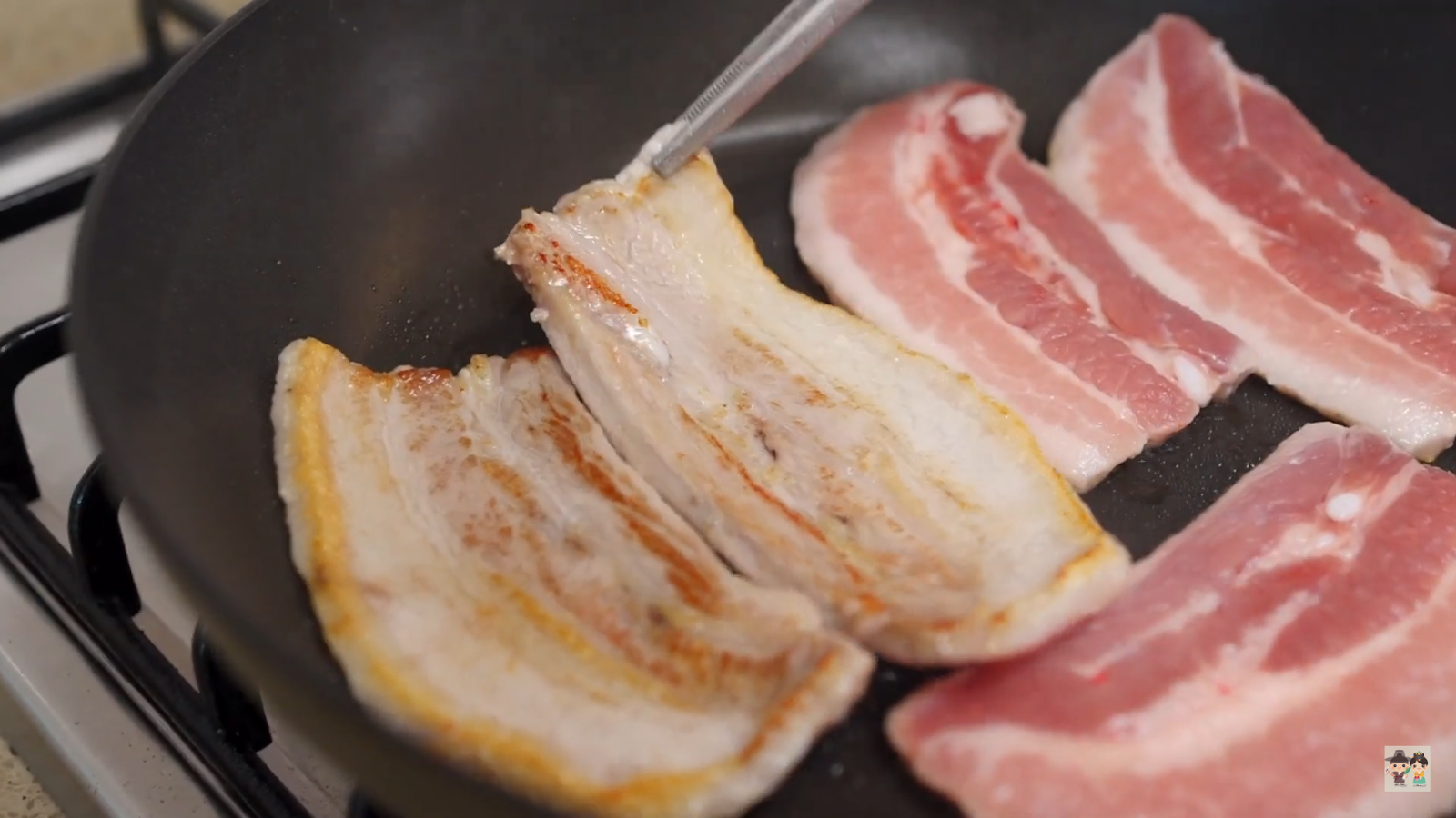 Aaron searing the Pork Belly