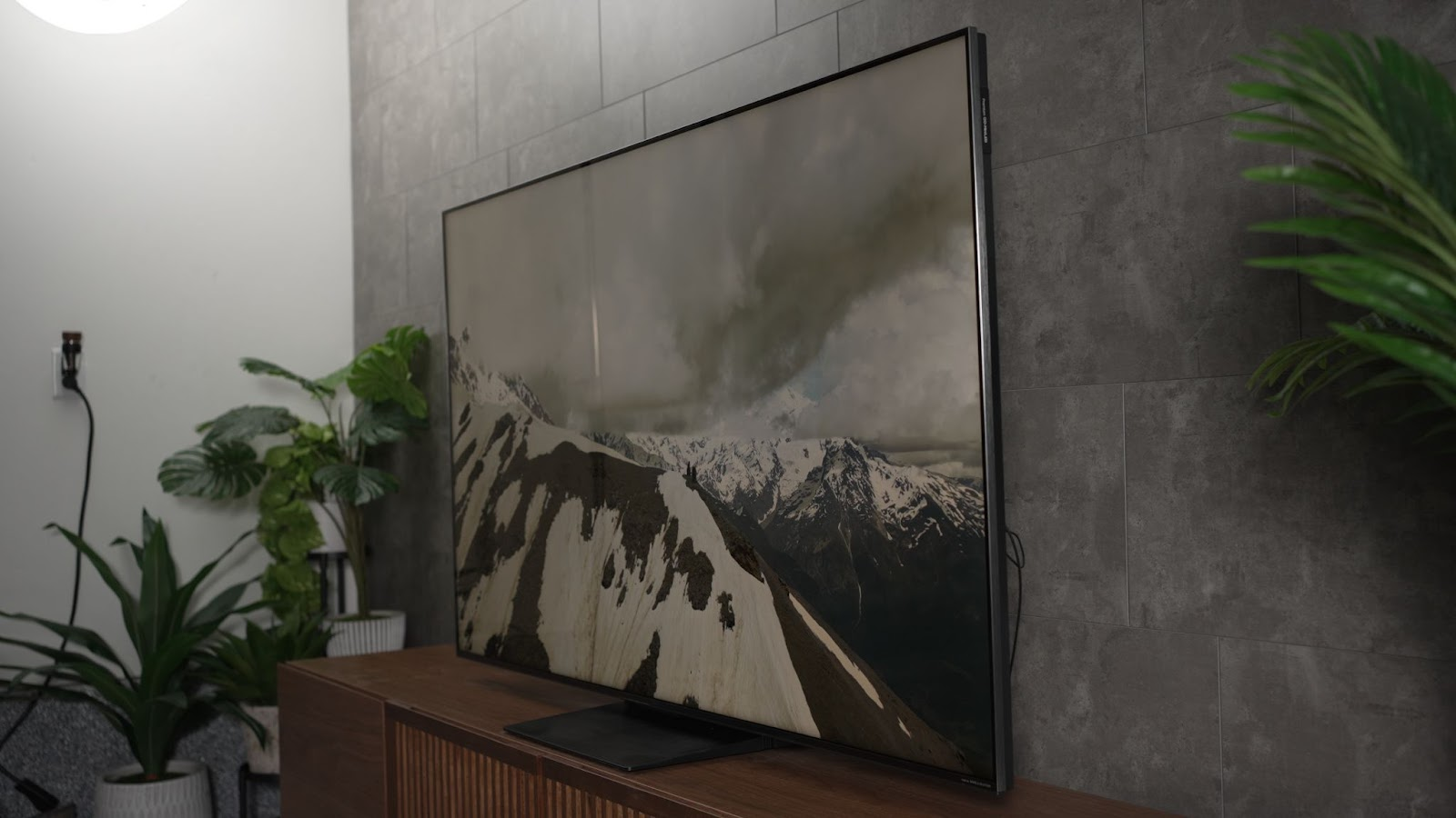 TCL QM7K TV in living room, angle view.