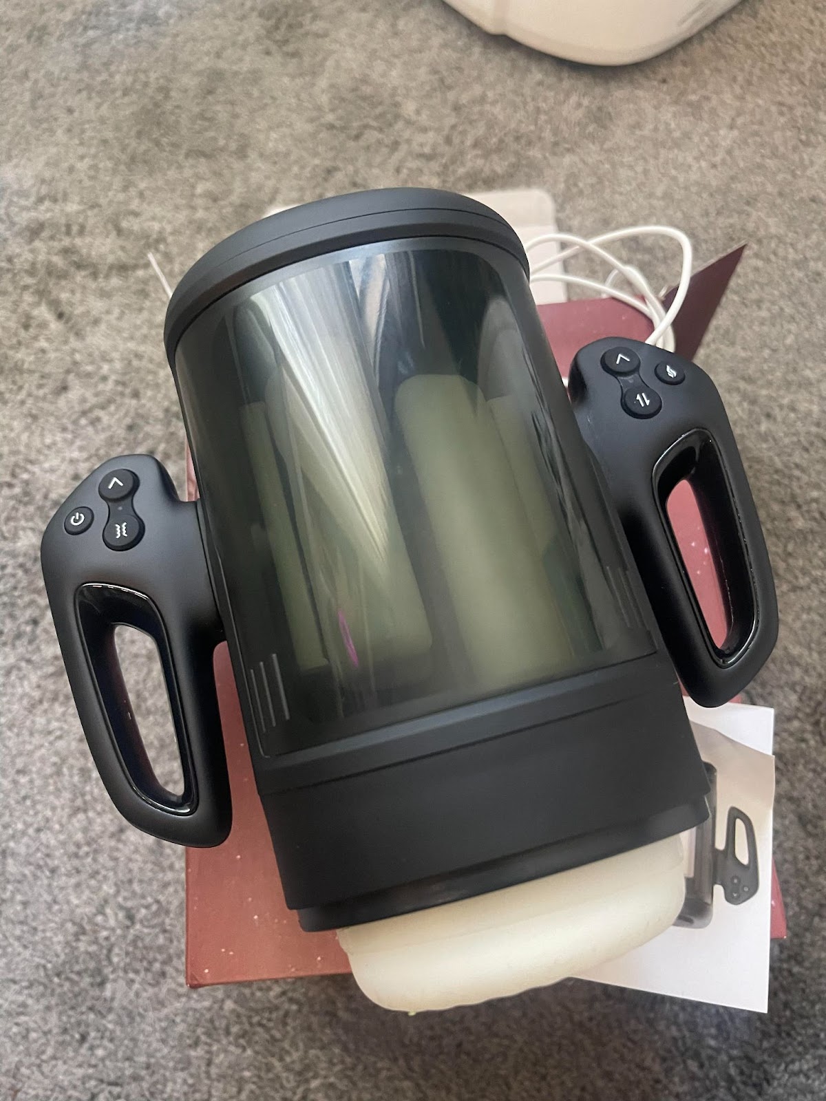 photo of Double-Handed, Phone Mountable Cock Masturbator Sleeve with control buttons and cock heating features owned by gay xxx onlyfans content creator Dallas Knoxxx