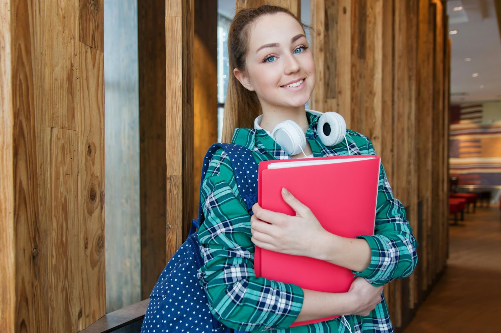 A young student holding a book