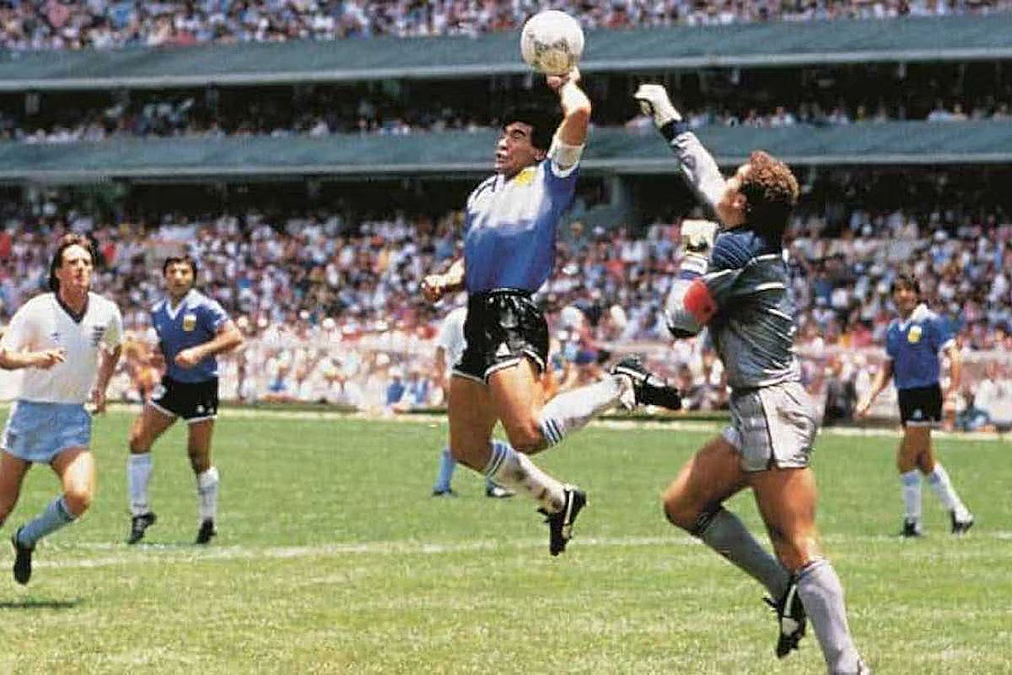 Maradona scores the Hand of God goal in the 1986 FIFA World Cup