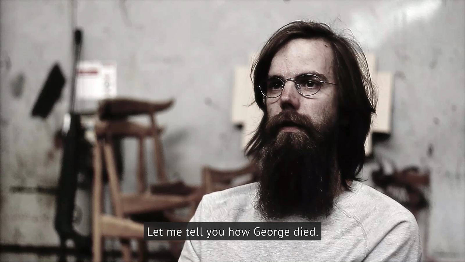 A screenshot of one of Welcome To Elk's documentary subjects. The subtitle reads "Let me tell you how George died."