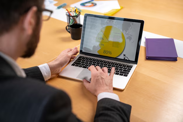 Man checking content performance metrics on laptop