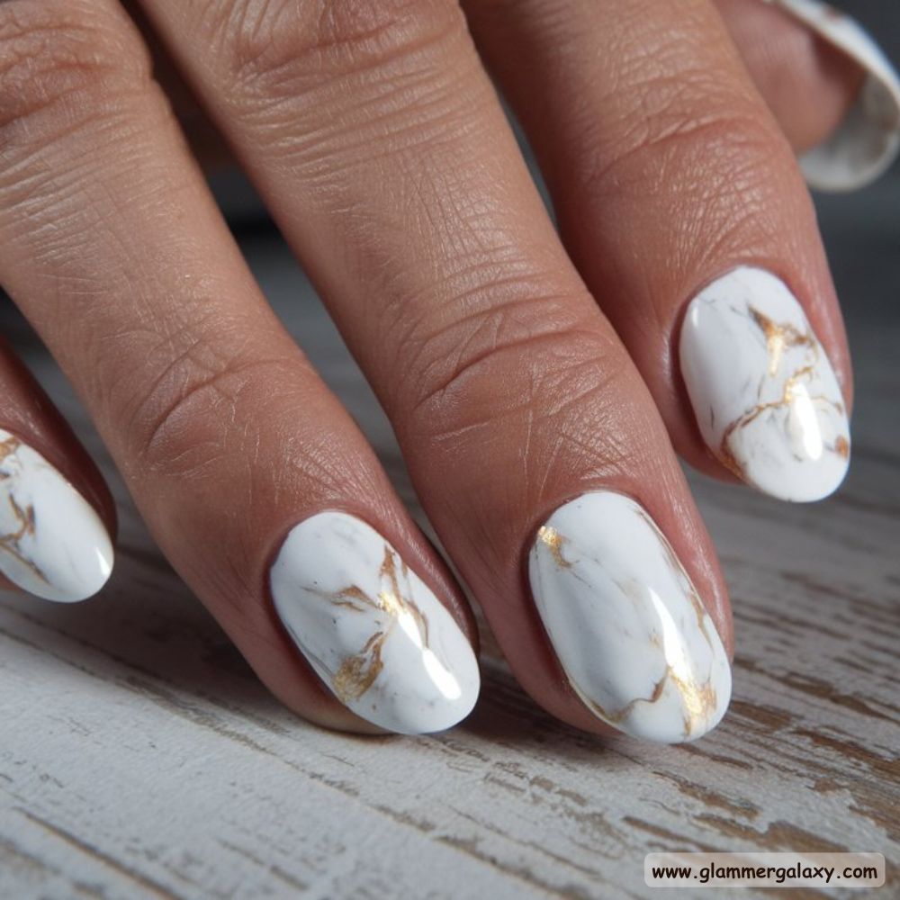 White Fall Nails having Marble with Gold Veins
