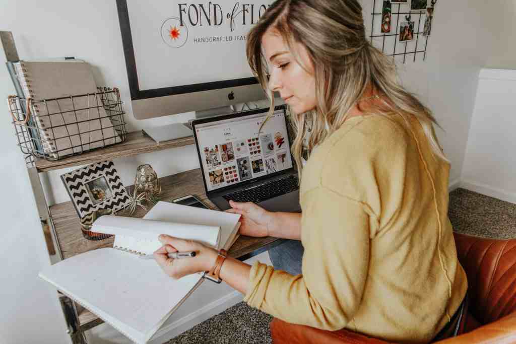 Woman planning the promotion for her online course