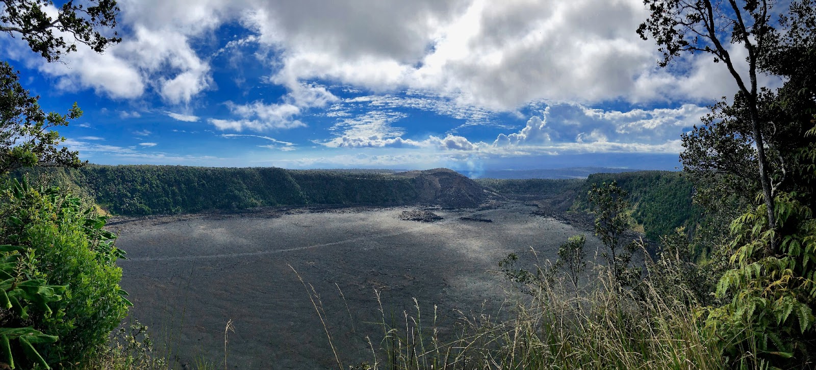 A luxury helicopter soaring over glowing lava fields on the Big Island of Hawai‘i.