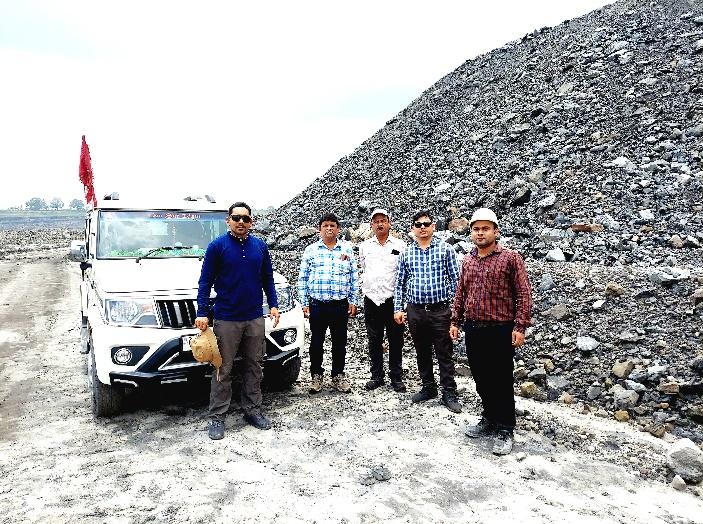 A group of men standing in front of a pile of rocks

AI-generated content may be incorrect.