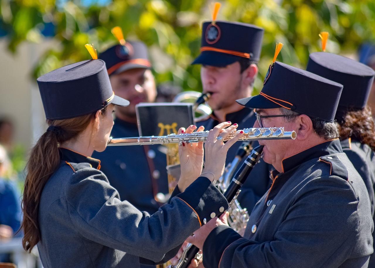 A group of people playing instruments

Description automatically generated