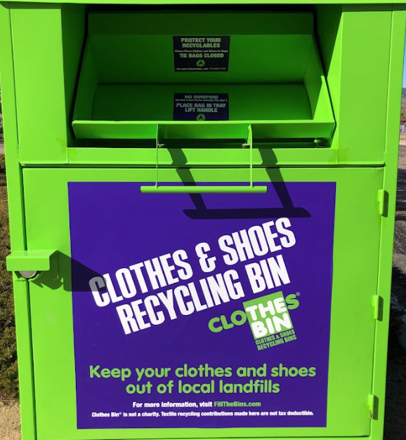 image of the Go Green clothing bin. Text of Clothes and shoes recycling bin, Keep your clothes and shoes out of local landfills