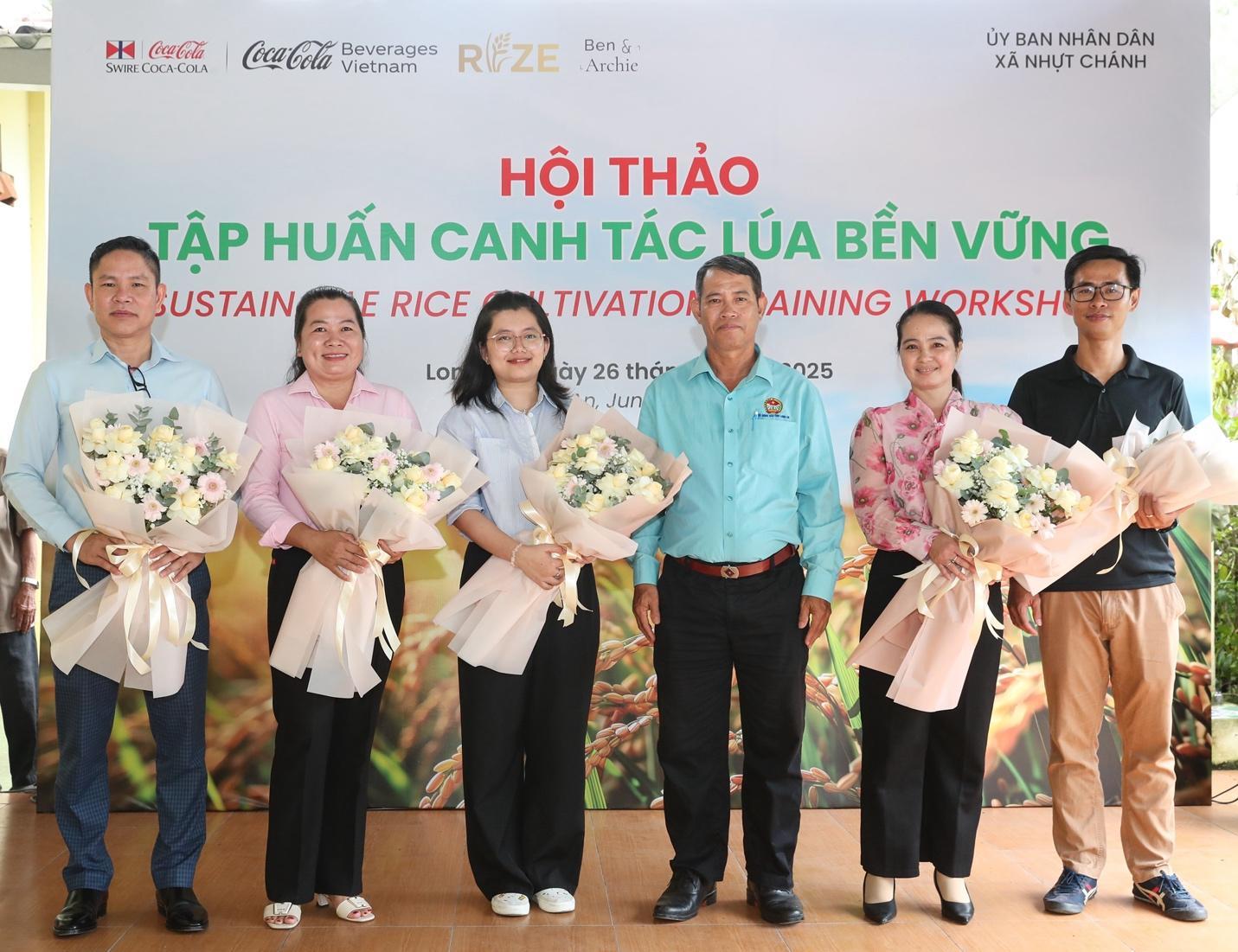 A group of people holding flowers

Description automatically generated