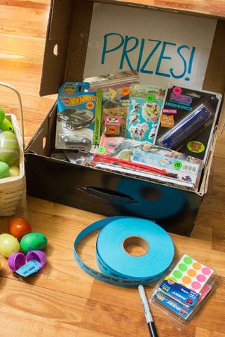 easter egg hunt ideas, box labeled prizes full of games and toys