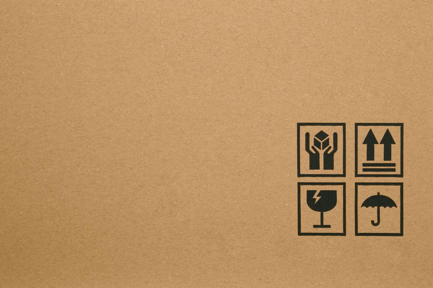 Fragile packaging symbols on the cardboard box