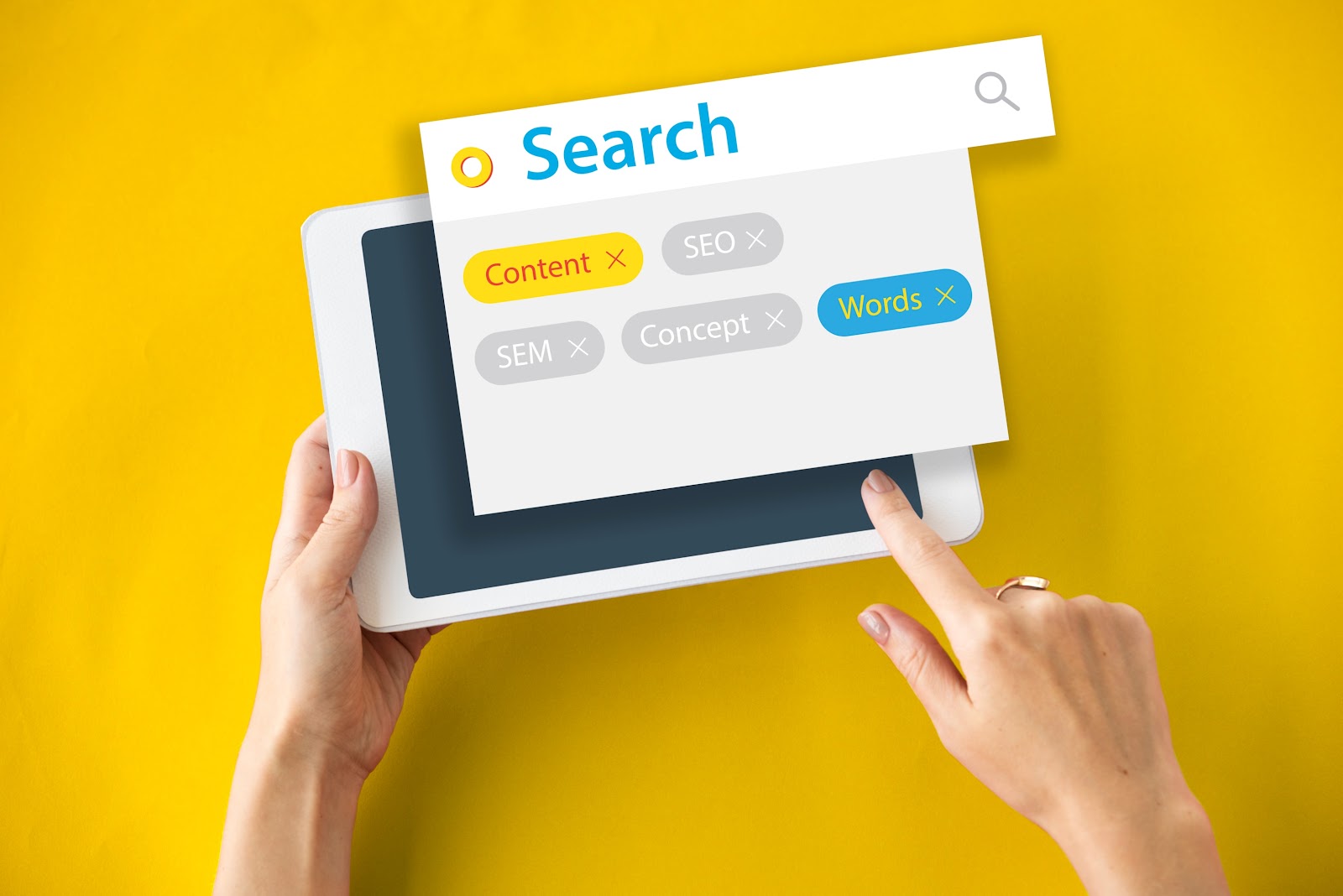 A tablet user performing a keyword search with filters like SEO, SEM, and content. The image represents keyword segmentation and how ecommerce data analytics supports search engine optimization and marketing efforts.