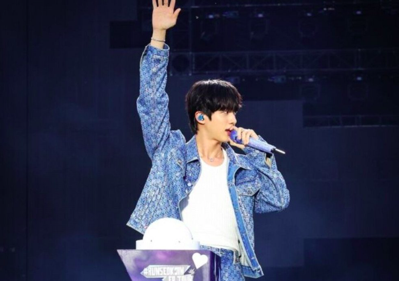 This contains an image of BTS Jin 