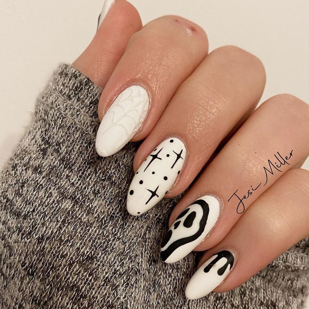 Simple White Nail Design having black and white Halloween nails