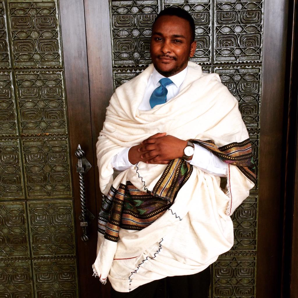 Diaspora man dressed in cultural Habesha attire, highlighting the formal Gabi garment used for special occasions