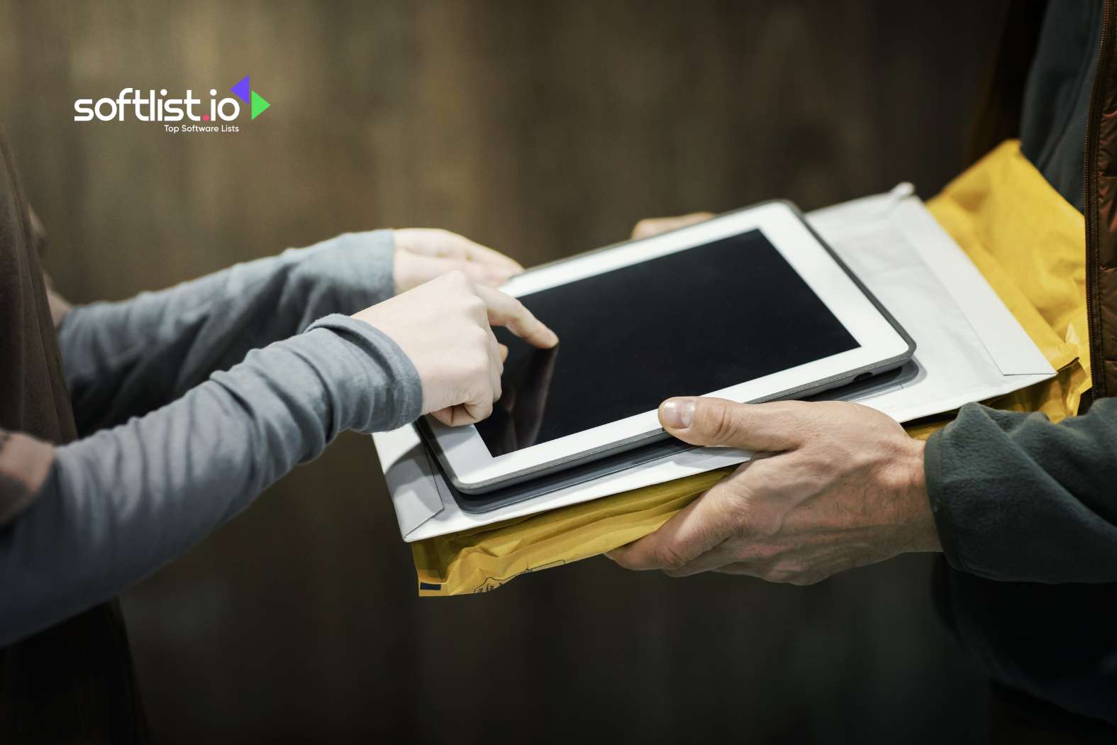 Two individuals using a tablet for document transfer and signing.