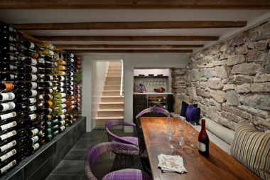 wine cellar design ideas ways to create a tasting haven basement tasting area with long table and stone wall custom built michigan