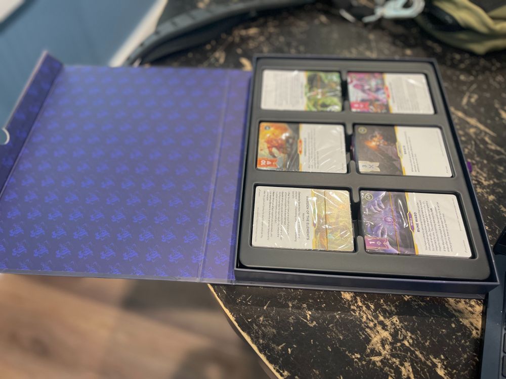 The same box, opened up to reveal 6 need decks of cards. 