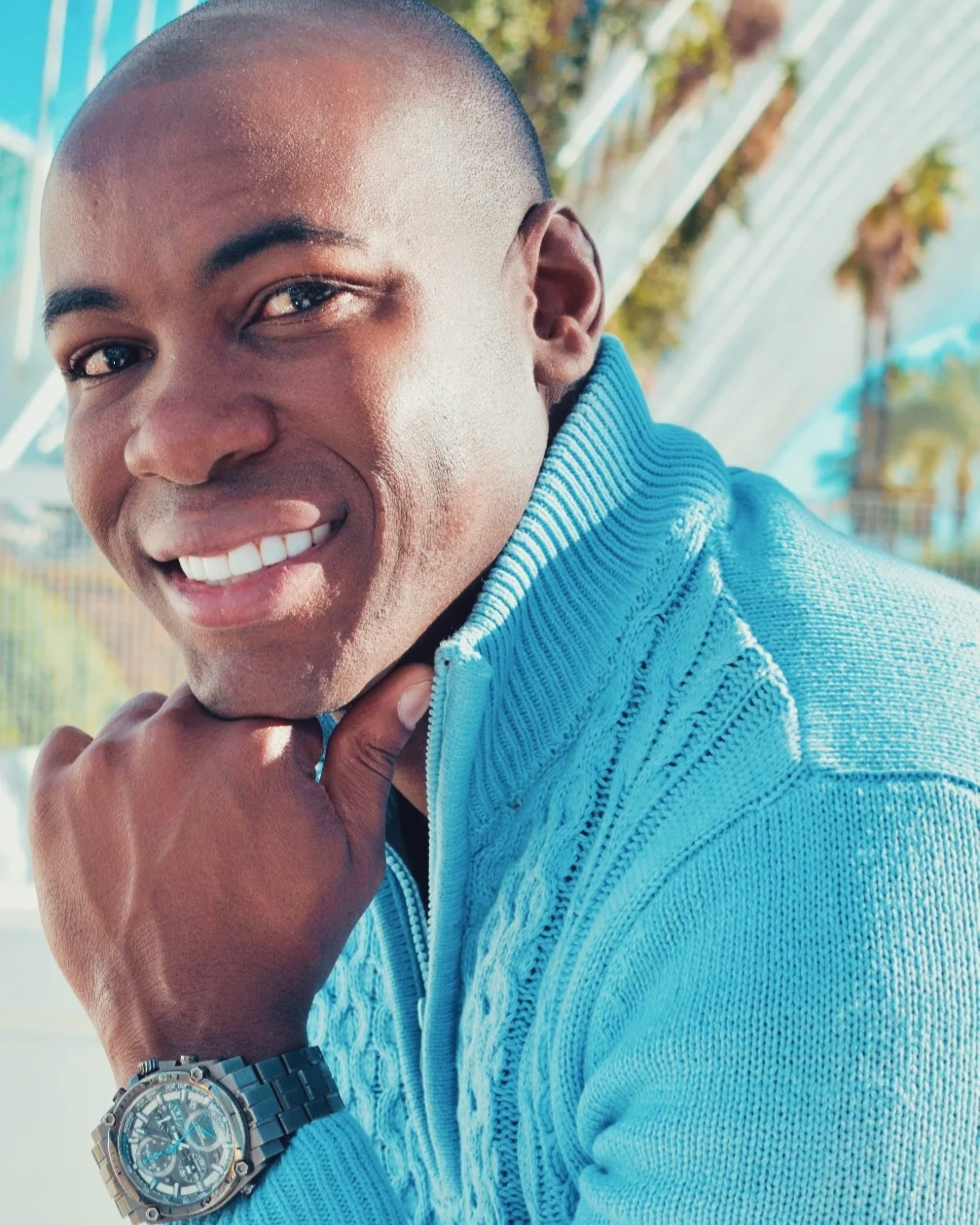 A person in a blue sweater  AI-generated content may be incorrect.