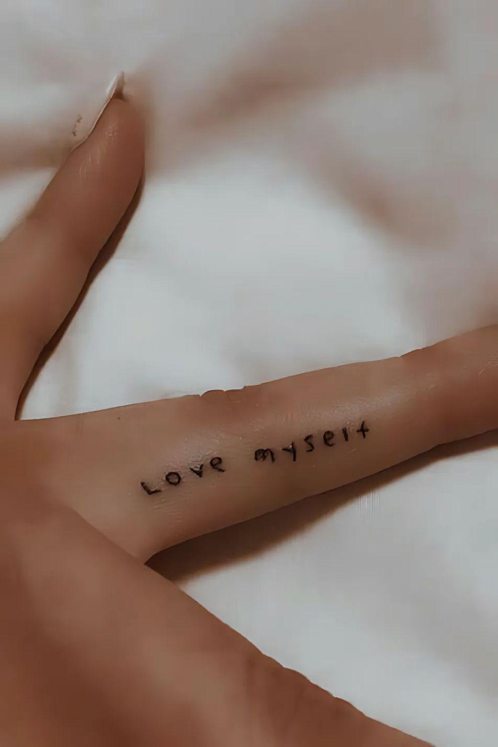 Initial Finger Tattoo