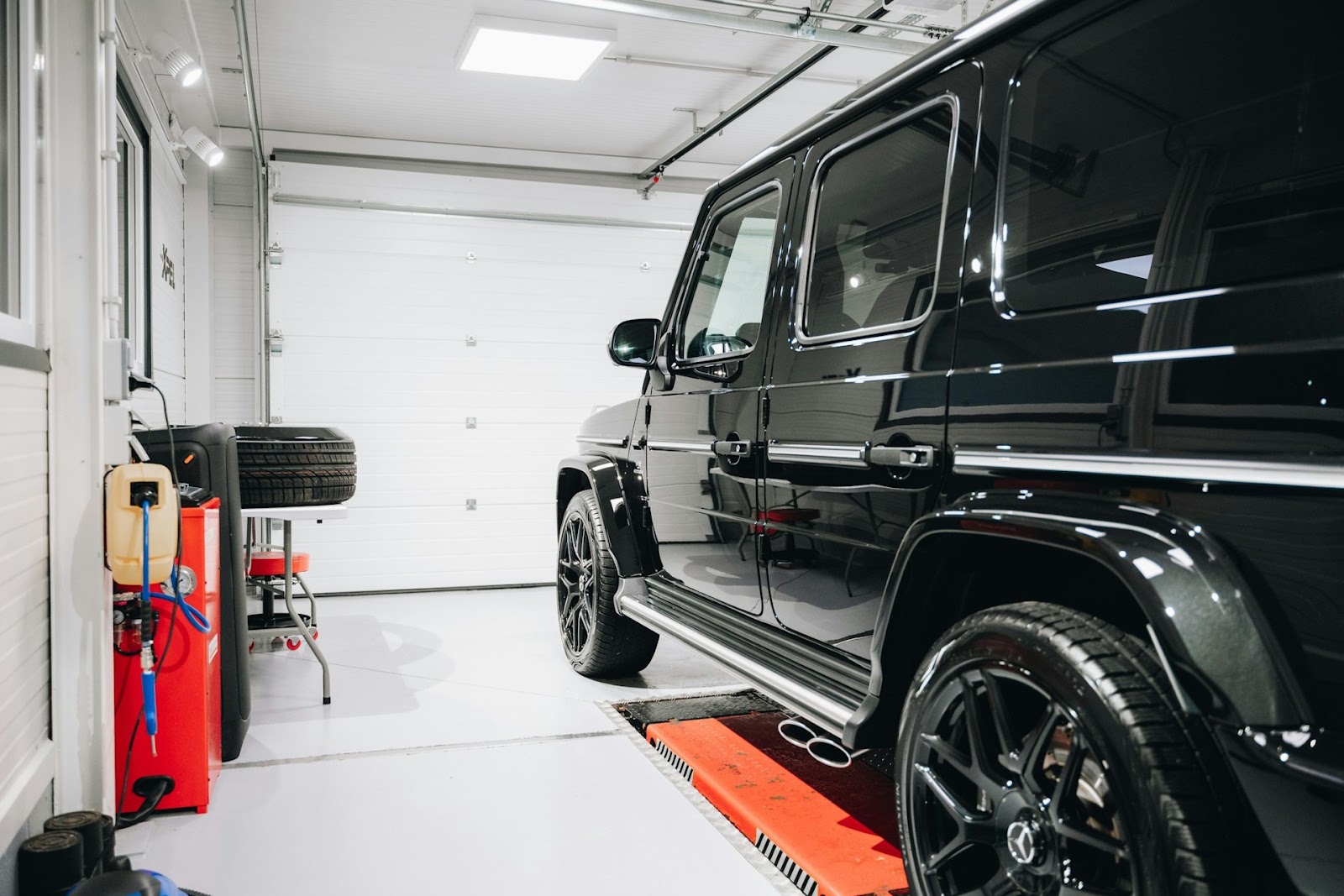 Black car in auto shop.