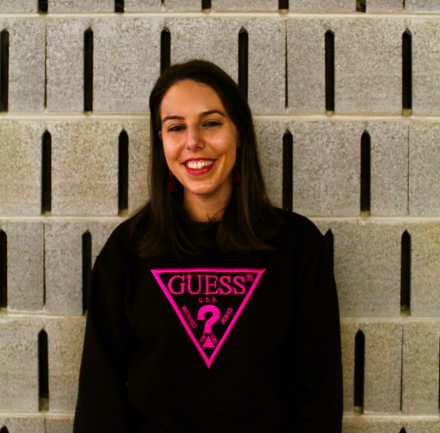 A person smiling in front of a wall

AI-generated content may be incorrect.