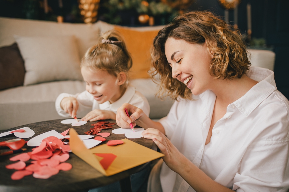 Mother helping her daughter make a DIY teacher appreciation gift