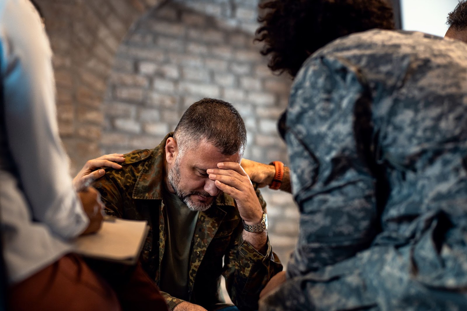 man with head bowed