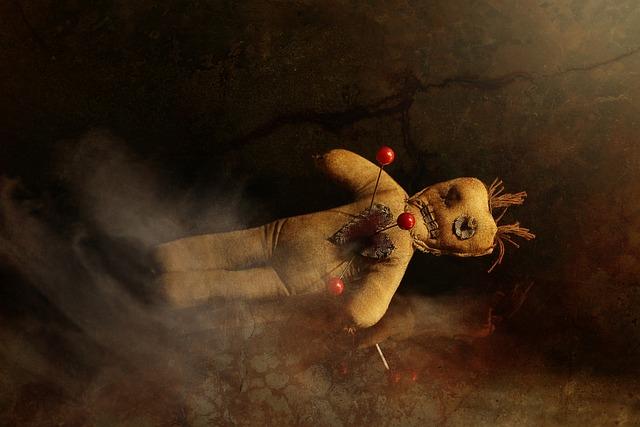 A stuffed doll with needles on it

Description automatically generated