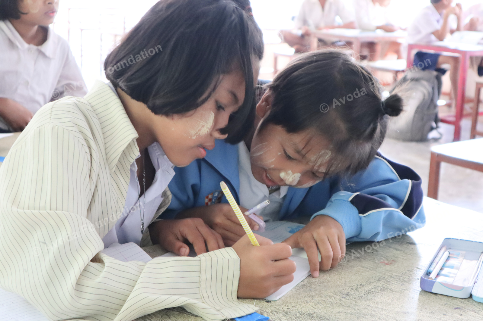 Displaced child studying at a rural learning center
