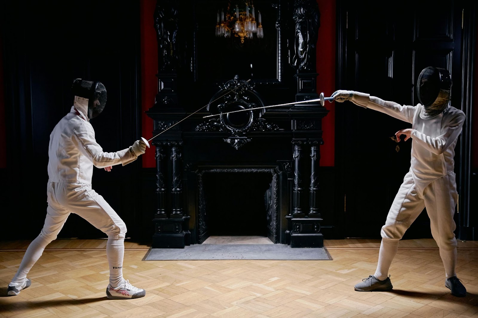 Two students sparring with light swords