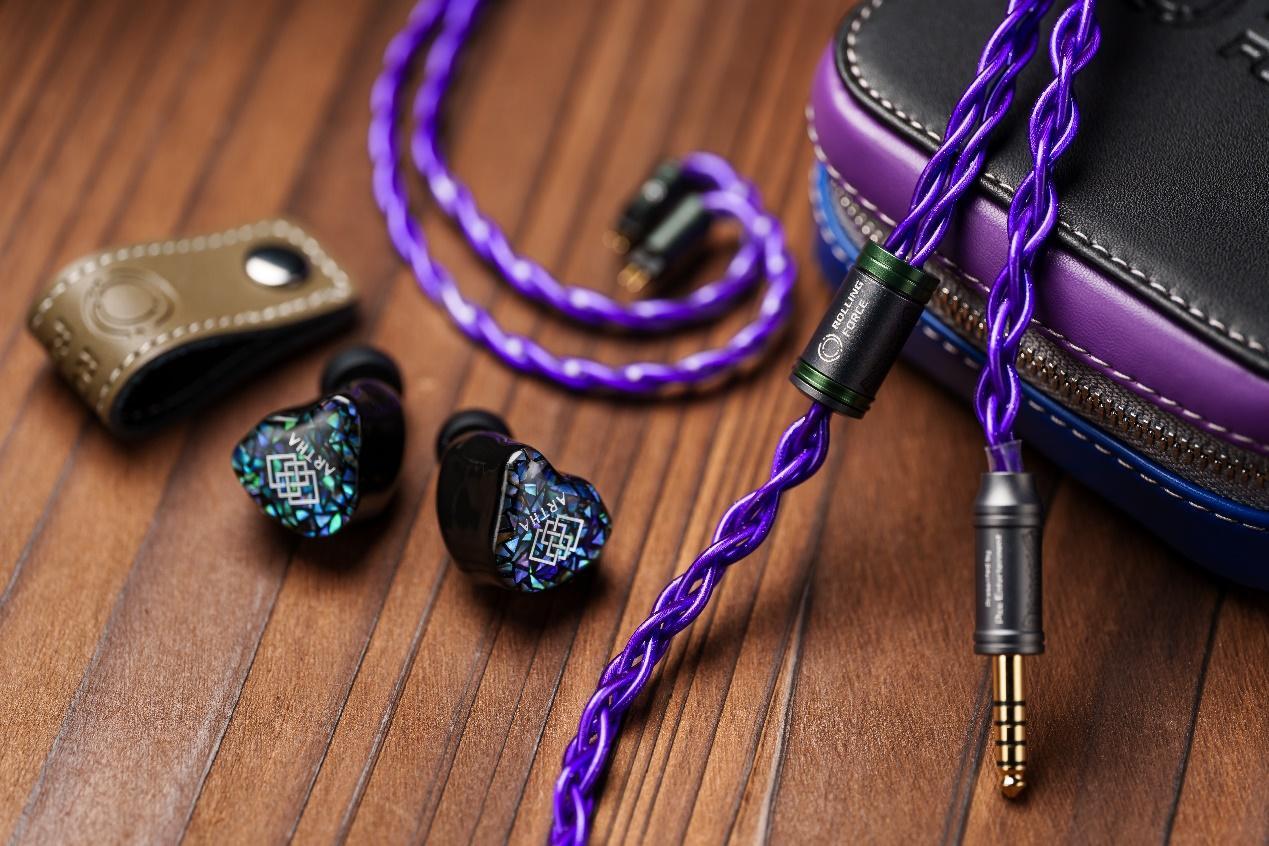 A purple cord and earphones

Description automatically generated