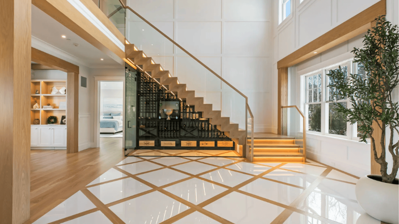 Tour This 8,094 Sq Ft Shingle-Style Waterfront Estate in Quogue, NY with Floating Staircase and 300-Bottle Wine Cellar