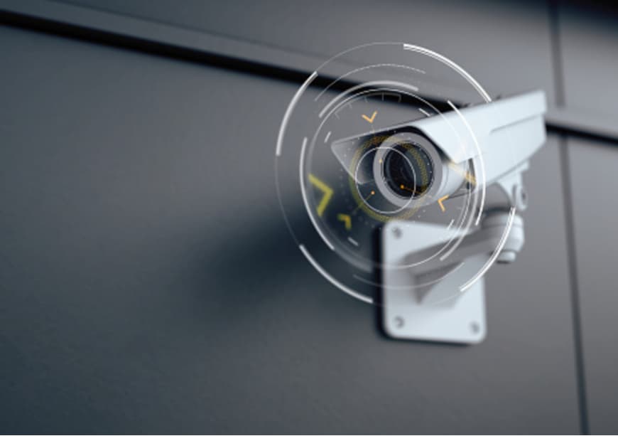 Modern security surveillance camera with digital overlays representing advanced monitoring technology