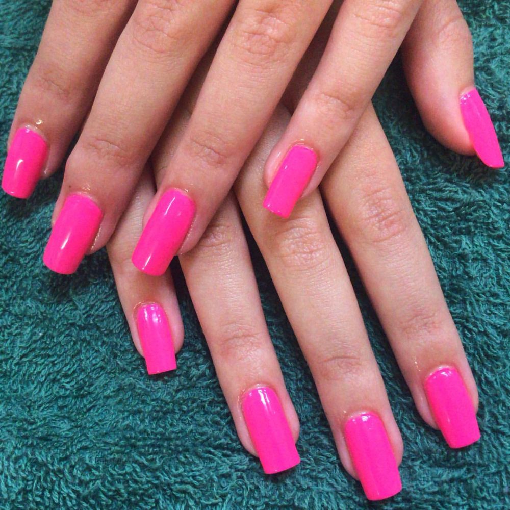 Close up of nails with simple pink nail designs having Pink Square Nails