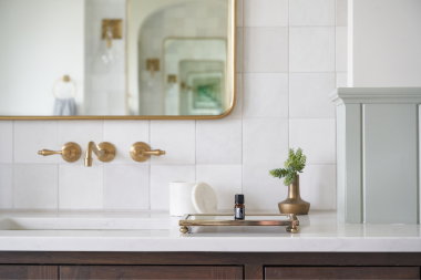 how to select the perfect countertops for your bathroom remodel quartz countertop with gold finished faucet and mirror frame custom built michigan