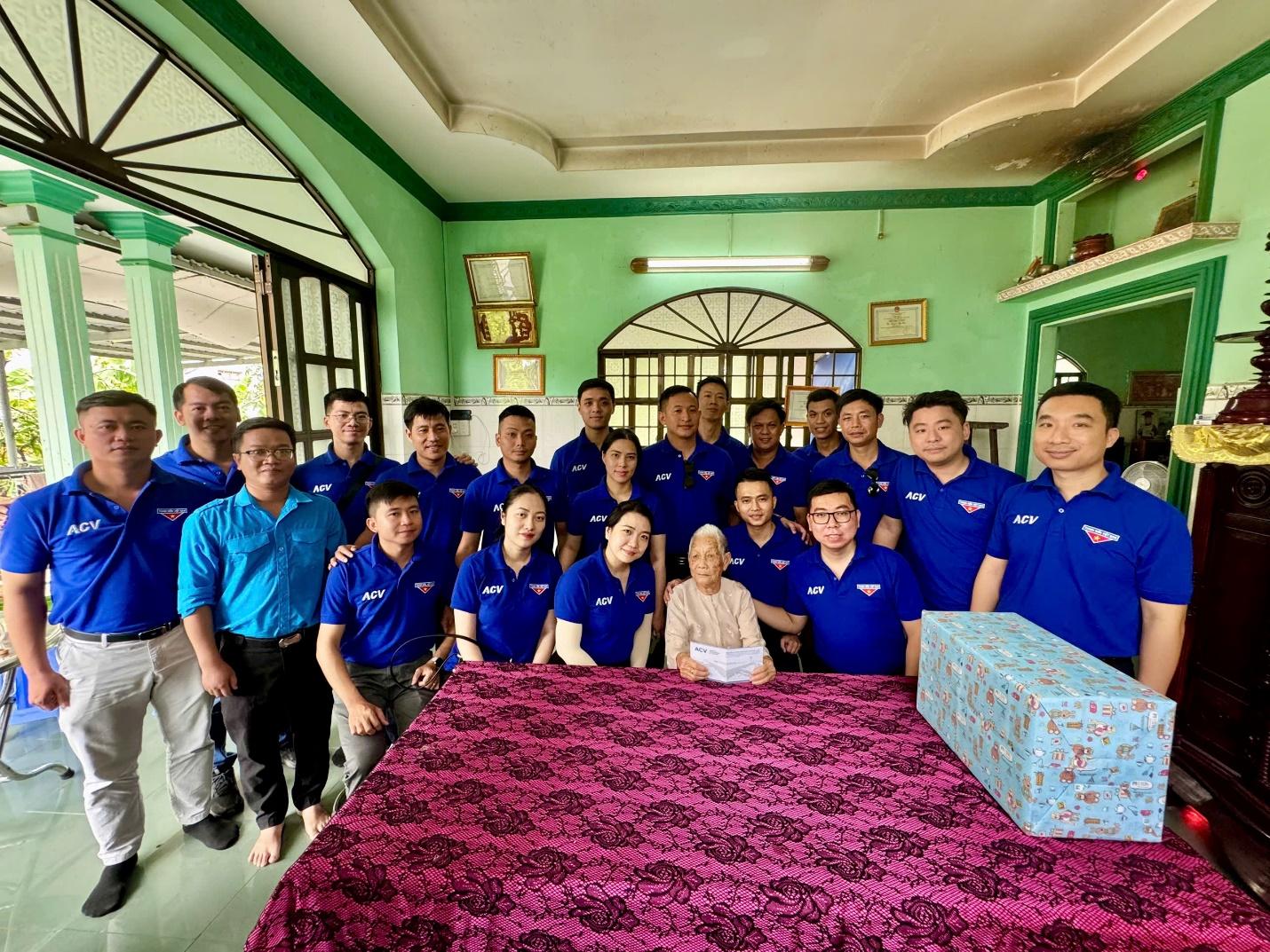 A group of people in blue shirtsDescription automatically generated