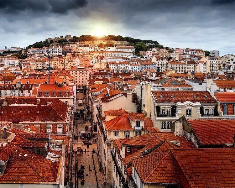 Top view of Lisbon with rooftops in red and brown, shaped like huts.