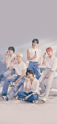 This contains an image of TXT members  on white and blue jean