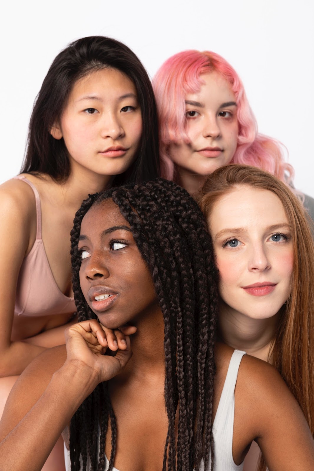 An image with four girls with different types of hair