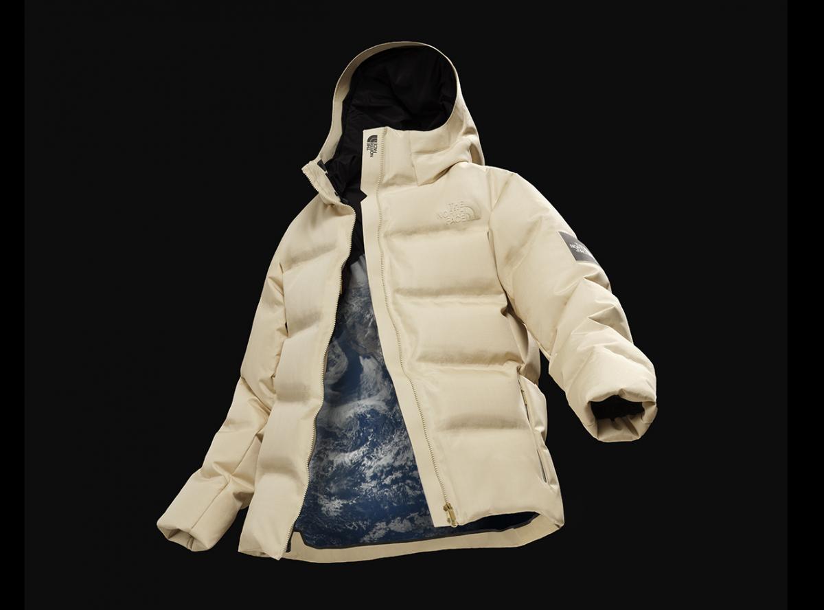 beige coloured outerwear jacket on black background - a product resulting from joint research and development with GOLDWIN Inc.